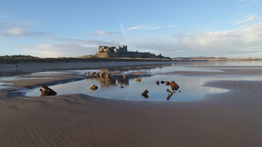 Alnwick Castle and Scottish Borders Tour from Edinburgh - Bamburgh: beach views and a 5th-century castle on volcanic rock