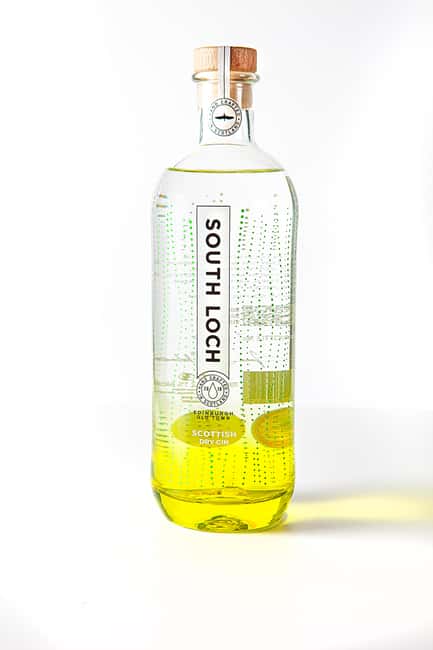 Edinburgh: Guided Gin Tasting at 56 North Distillery - The warm welcome: gin bar setting, tonic, and copper stills