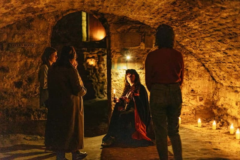 Edinburgh: Underground Vaults Evening Ghost Tour with Whisky - Old Town street storytelling with an interactive edge