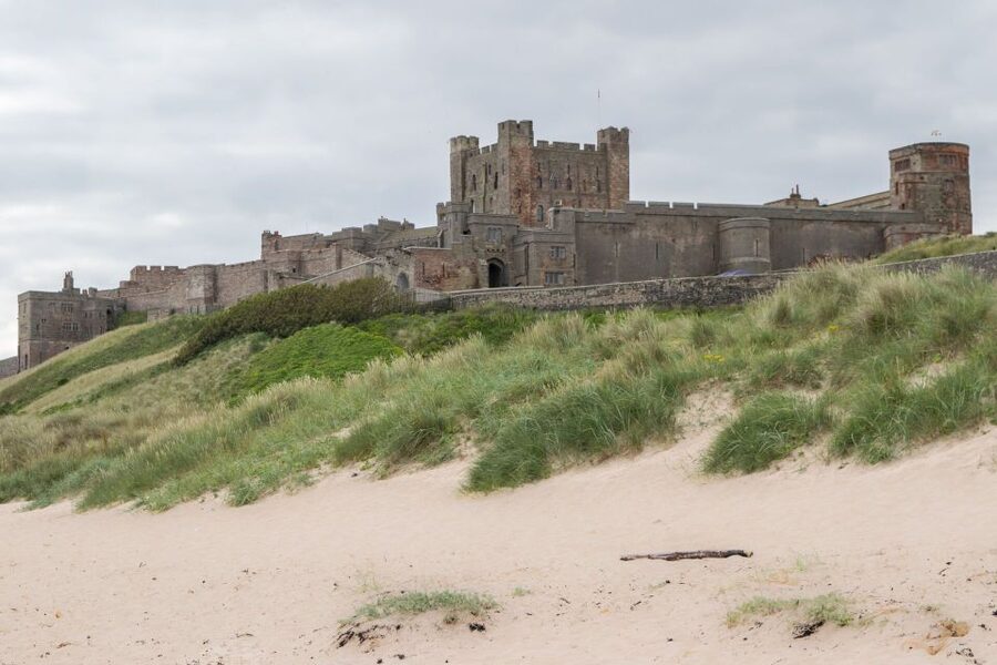 From Edinburgh: Day Trip to Bamburgh and Alnwick Castle - Bamburgh Castle and the sea air: where the past meets the beach
